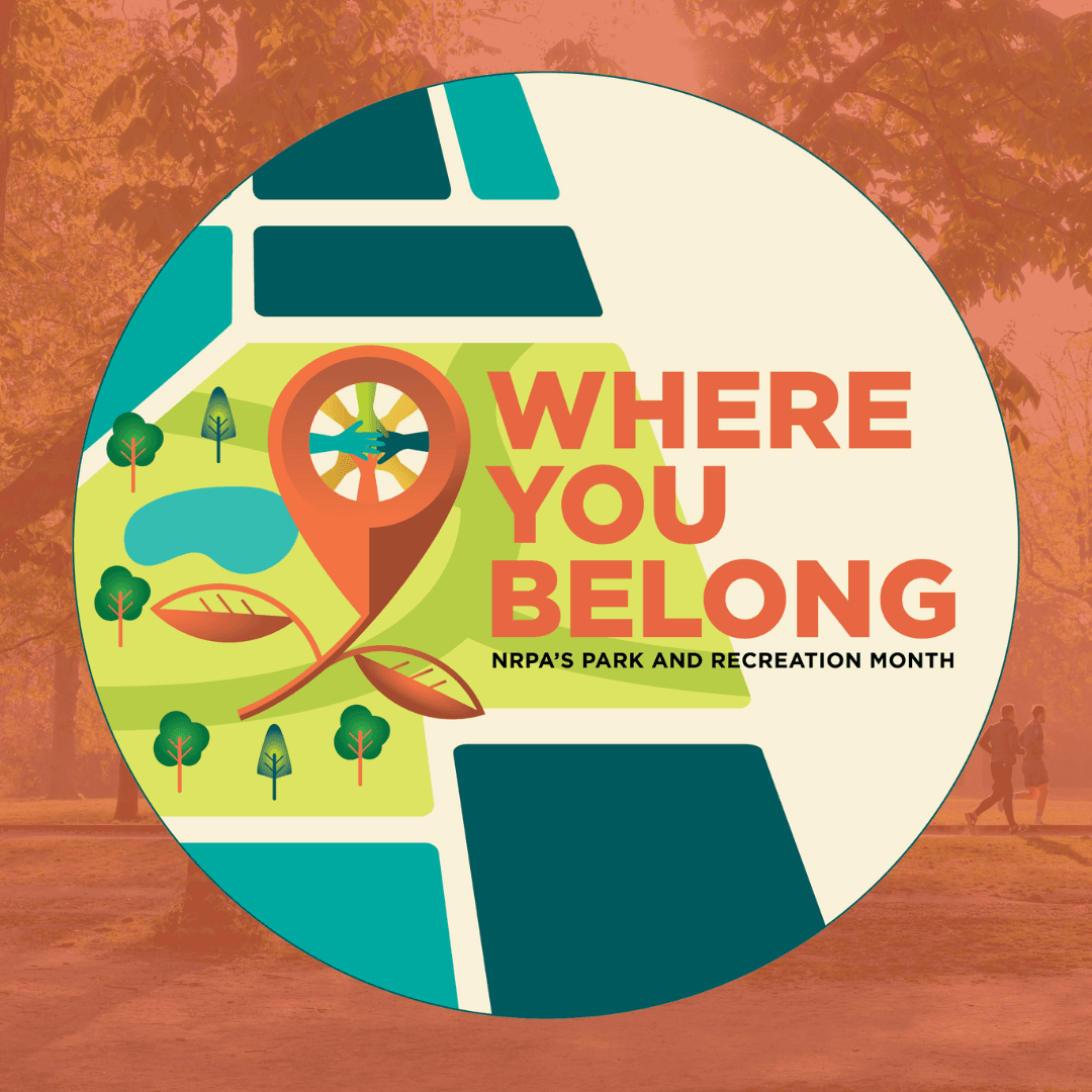 park with trees and two runners on the trail with the NPRM logo